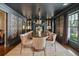 Elegant dining room with dark walls, statement wallpaper, and a grand table set for formal dining at 1106 Meadowcroft Ln, Mount Pleasant, SC 29464