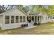 Beautiful home exterior featuring a sunroom, covered porch, and well-manicured lawn at 1106 Meadowcroft Ln, Mount Pleasant, SC 29464