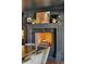 Elegant fireplace with dark walls, a decorative mantle, and a marble surround at 1106 Meadowcroft Ln, Mount Pleasant, SC 29464
