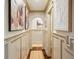 Long hallway adorned with decorative wall art adding a touch of elegance and sophistication at 1106 Meadowcroft Ln, Mount Pleasant, SC 29464