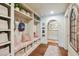 Hallway features a built-in bench, coat rack, and arched doorway at 1106 Meadowcroft Ln, Mount Pleasant, SC 29464