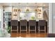 Modern kitchen island with bar stool seating and pendant lighting above at 1106 Meadowcroft Ln, Mount Pleasant, SC 29464