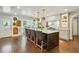 Bright kitchen features a large island, stainless steel appliances, and hardwood floors at 1106 Meadowcroft Ln, Mount Pleasant, SC 29464