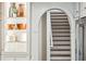 Kitchen with custom shelving that leads to the staircase at 1106 Meadowcroft Ln, Mount Pleasant, SC 29464