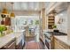 Gourmet kitchen featuring stainless steel appliances, gas range, and adjacent dining area at 1106 Meadowcroft Ln, Mount Pleasant, SC 29464