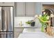 Elegant kitchen with stainless steel refrigerator, countertops, and designer faucet at 1106 Meadowcroft Ln, Mount Pleasant, SC 29464