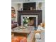 Beautiful fireplace with brick surround, flanked by built-in shelving in a well-decorated living room at 1106 Meadowcroft Ln, Mount Pleasant, SC 29464
