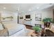 Bright main bedroom with fan, wood floors, dresser, mounted TV, and neutral decor at 1106 Meadowcroft Ln, Mount Pleasant, SC 29464