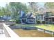 Backyard featuring waterfront view and cozy patio area with outdoor furniture and a grill at 1136 Shadow Lake Cir # 54, Mount Pleasant, SC 29464