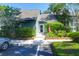 Inviting townhome entrance featuring an American flag, fresh landscaping, and assigned parking at 1136 Shadow Lake Cir # 54, Mount Pleasant, SC 29464