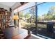 Sun-drenched office desk overlooking serene water views and lush greenery at 1136 Shadow Lake Cir # 54, Mount Pleasant, SC 29464