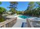 Community pool with surrounding deck overlooking a tranquil pond and lush green landscaping at 1136 Shadow Lake Cir # 54, Mount Pleasant, SC 29464