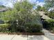 Charming home with a flowering tree in front, complemented by well-maintained landscaping at 1136 Shadow Lake Cir, Mount Pleasant, SC 29464