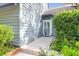Charming townhouse with well-manicured landscaping and a inviting walkway to the entrance at 1136 Shadow Lake Cir, Mount Pleasant, SC 29464