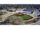 Aerial view of a community park featuring a baseball field, playground, and recreational area at 1142 Camden St, North Charleston, SC 29405