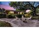 Backyard patio featuring an outdoor fire pit, seating and a lush green lawn at 1142 Camden St, North Charleston, SC 29405