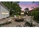 Backyard area featuring a fire pit with chairs for outdoor entertainment at 1142 Camden St, North Charleston, SC 29405