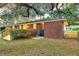 Cozy brick house backyard, featuring a deck, gate and lush green grass, perfect for outdoor gatherings at 1142 Camden St, North Charleston, SC 29405