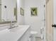 Bright bathroom features a white vanity, framed mirror, and tiled shower at 1142 Camden St, North Charleston, SC 29405
