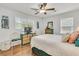 Bright bedroom features hardwood floors, ceiling fan, and charming decor at 1142 Camden St, North Charleston, SC 29405