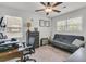 Bedroom features hardwood floors, ceiling fan, and desk at 1142 Camden St, North Charleston, SC 29405