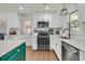 Bright kitchen featuring an oven, microwave, white cabinets, and stainless dishwasher at 1142 Camden St, North Charleston, SC 29405