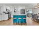 Open-concept kitchen with island, stainless appliances, and access to the outdoors at 1142 Camden St, North Charleston, SC 29405