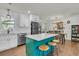 Open kitchen with island, dining area, stainless steel appliances, and hardwood floors at 1142 Camden St, North Charleston, SC 29405