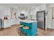 Spacious kitchen featuring a center island, stainless steel refrigerator and white cabinetry at 1142 Camden St, North Charleston, SC 29405