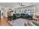 Comfortable living room with a large sectional sofa, hardwood floors, and natural light at 1142 Camden St, North Charleston, SC 29405