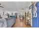 Open-concept living space with hardwood floors, modern finishes, and seamless flow to dining area at 1142 Camden St, North Charleston, SC 29405