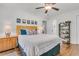 Bedroom with hardwood floors, ceiling fan, and colorful wall decor at 1142 Camden St, North Charleston, SC 29405
