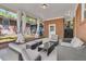 Covered patio with comfortable seating and brick accents at 1142 Camden St, North Charleston, SC 29405