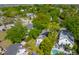 Aerial view of homes with lush landscaping, pools, and neighborhood streets at 115 Peachtree St, Charleston, SC 29403