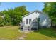 Cozy backyard features a charming deck with double doors and lush green grass at 115 Peachtree St, Charleston, SC 29403