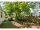 Large backyard has ample space to park, and mature trees providing shade at 115 Peachtree St, Charleston, SC 29403