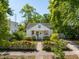 Charming two-story home with a well-manicured front yard and picket fence at 115 Peachtree St, Charleston, SC 29403