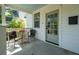 Cozy front porch with seating, providing a perfect spot to enjoy the outdoors and neighborhood views at 115 Peachtree St, Charleston, SC 29403