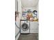 Laundry room features a washer and dryer along with wire rack storage, for easy chore management at 115 Peachtree St, Charleston, SC 29403