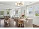 Stylish living and dining area featuring hardwood floors, ample natural light, and modern furnishings at 115 Peachtree St, Charleston, SC 29403