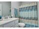 Clean bathroom featuring neutral walls, vanity, and patterned shower curtain at 117 Camellia Bloom Dr, Moncks Corner, SC 29461