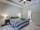 Spacious bedroom features a plush carpet, tray ceiling, and ensuite bathroom at 117 Camellia Bloom Dr, Moncks Corner, SC 29461