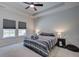 Comfortable bedroom featuring two windows for natural light, and a tray ceiling at 117 Camellia Bloom Dr, Moncks Corner, SC 29461