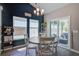 Eat-in dining area featuring modern lighting fixture, dark accent wall, and outside access at 117 Camellia Bloom Dr, Moncks Corner, SC 29461