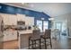 Well-appointed kitchen with an island, white cabinets, and wood-look flooring at 117 Camellia Bloom Dr, Moncks Corner, SC 29461