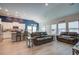 Open-concept living area with adjacent kitchen and wood-look flooring at 117 Camellia Bloom Dr, Moncks Corner, SC 29461