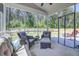 Inviting screened porch with comfortable seating and backyard views at 117 Camellia Bloom Dr, Moncks Corner, SC 29461