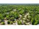 Aerial view of the neighborhood with mature trees, and a manicured lawn at 119 Savannah Round, Summerville, SC 29485