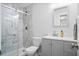 Modern bathroom with glass shower, gray vanity, and sleek, matching toilet at 119 Savannah Round, Summerville, SC 29485