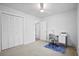 Bright bedroom with a closet, ceiling fan, desk, and neutral color carpet at 119 Savannah Round, Summerville, SC 29485
